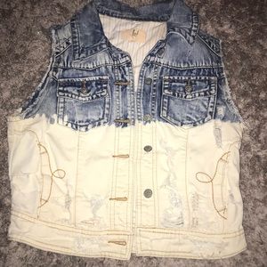 Sleeveless distressed jean jacket